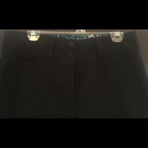 Deb size 14 pants w/ blue reptilian pattern.